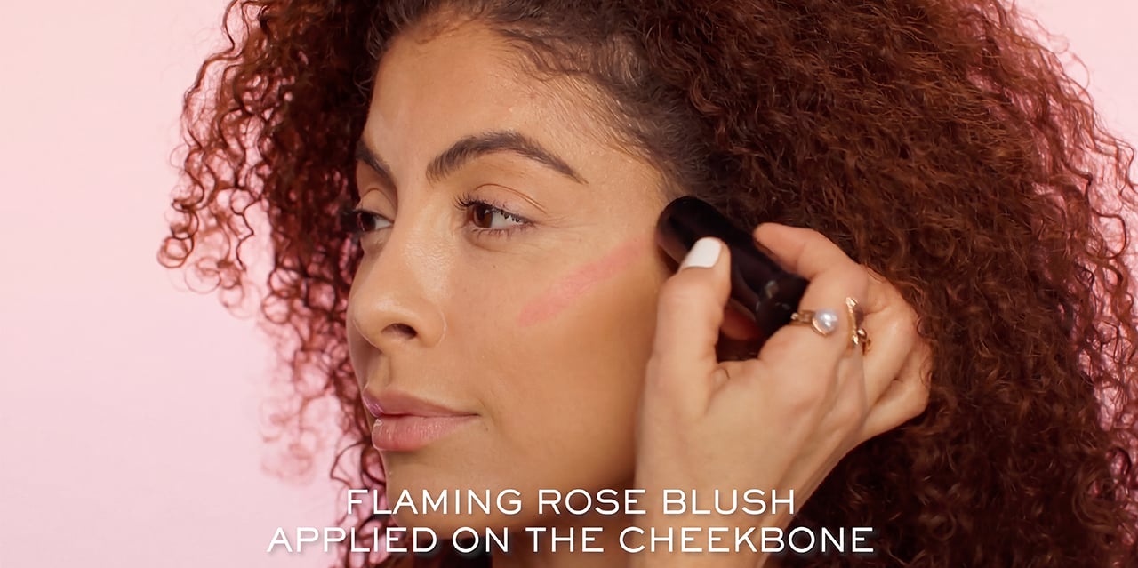 Blush stick placement just above cheek contour for a pop of color and radiance